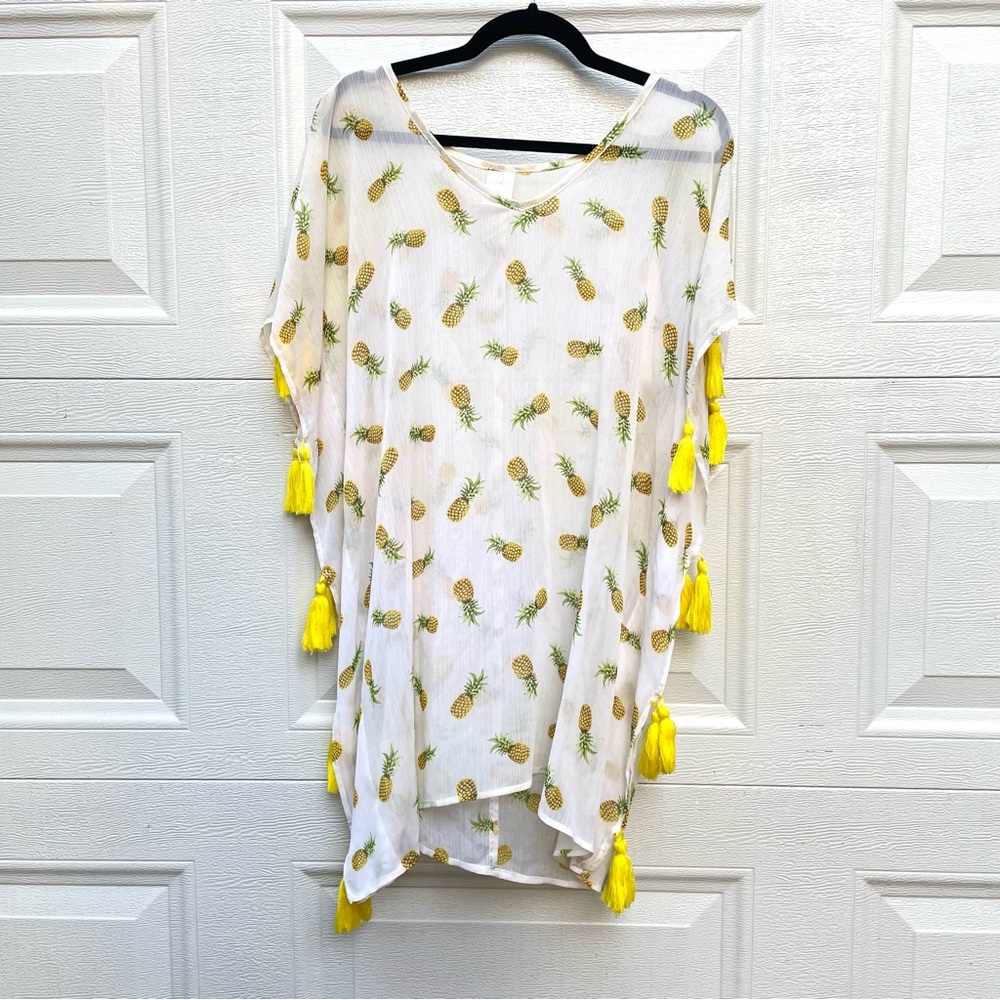 Size M swimsuit coverup poncho kimono pineapple print and tassels on sides.